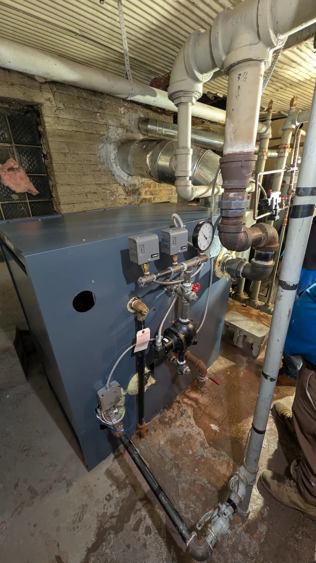 Furnace Turns On Then Shuts Off in Chicago: completed steam boiler installation with radiator piping