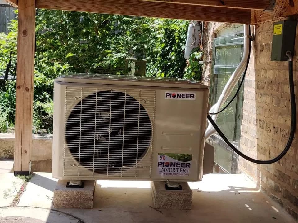 Smart Thermostat Installation & Setup Chicago — ductless mini-split outdoor unit mounted beside a Chicago home