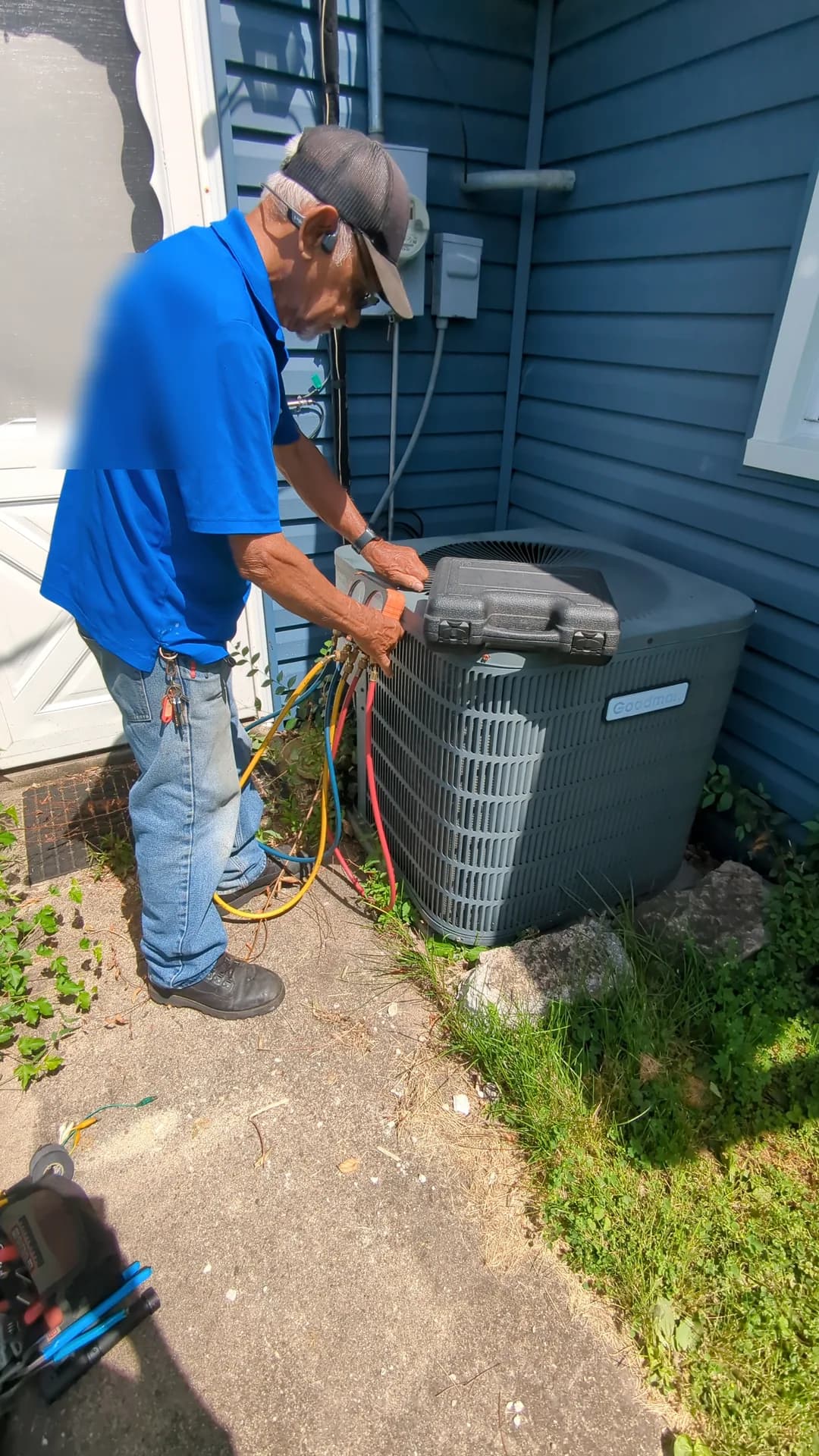 AC Repair & Diagnostics — Bernie's technician connecting diagnostic gauges to a residential air conditioner