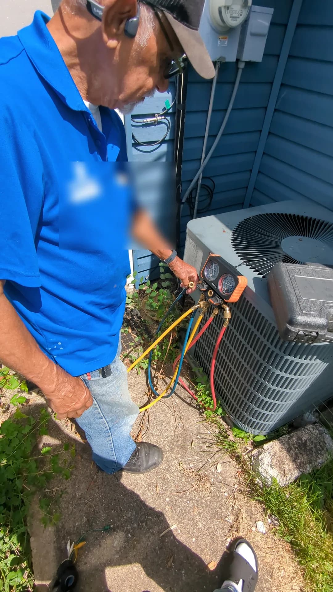 Annual AC Tune-Up & Refrigerant Check — technician adjusting diagnostic gauges during residential air-conditioner service