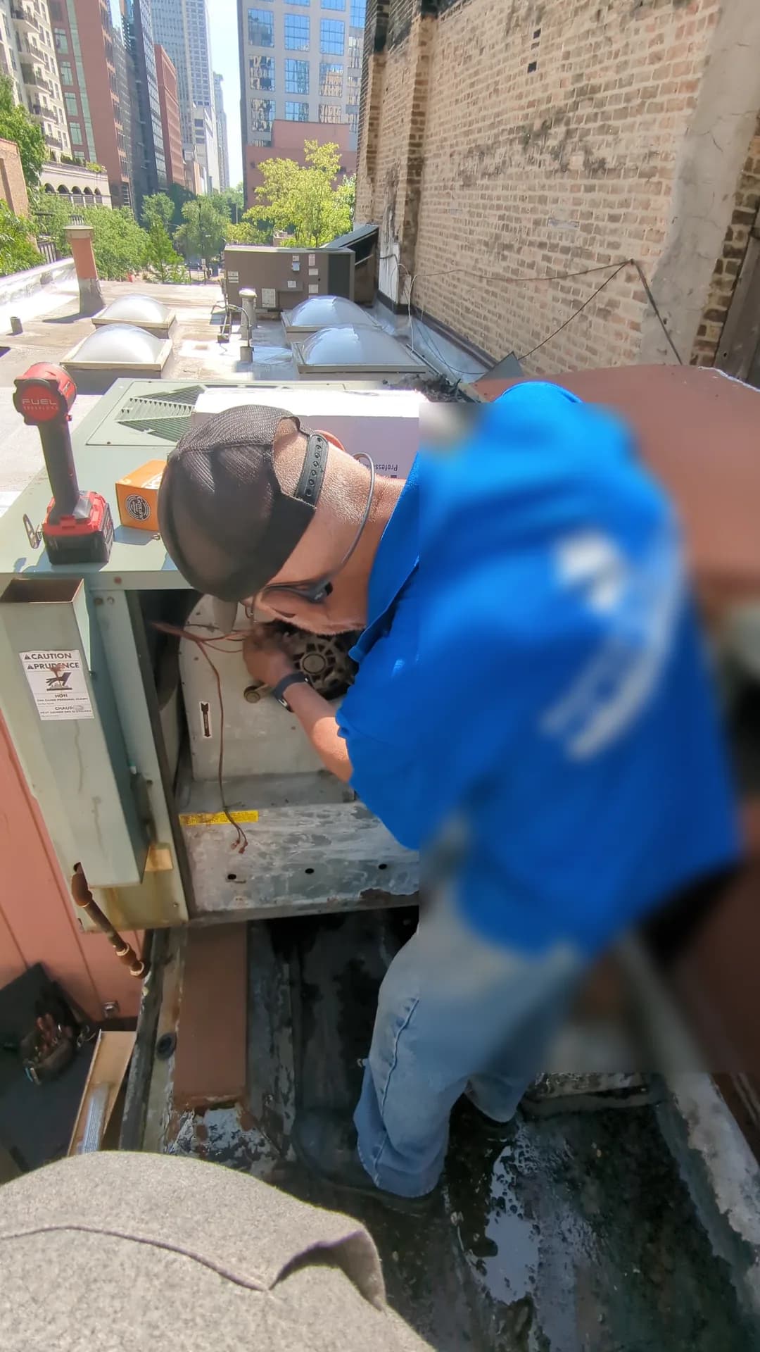 Humidifier & Dehumidifier Installation Chicago — technician servicing commercial rooftop HVAC equipment