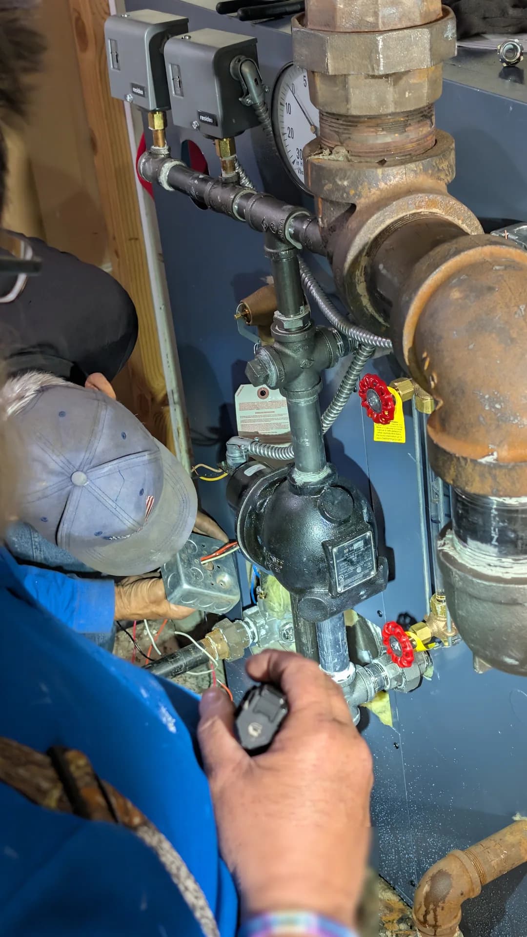 Carbon Monoxide Detection & Safety Devices Chicago — technician commissioning a steam boiler and radiator system