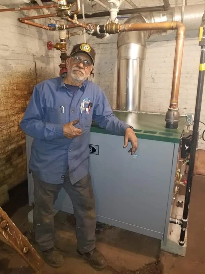 Lincoln Square HVAC Services — Bernie's technician with a steam boiler and radiator piping