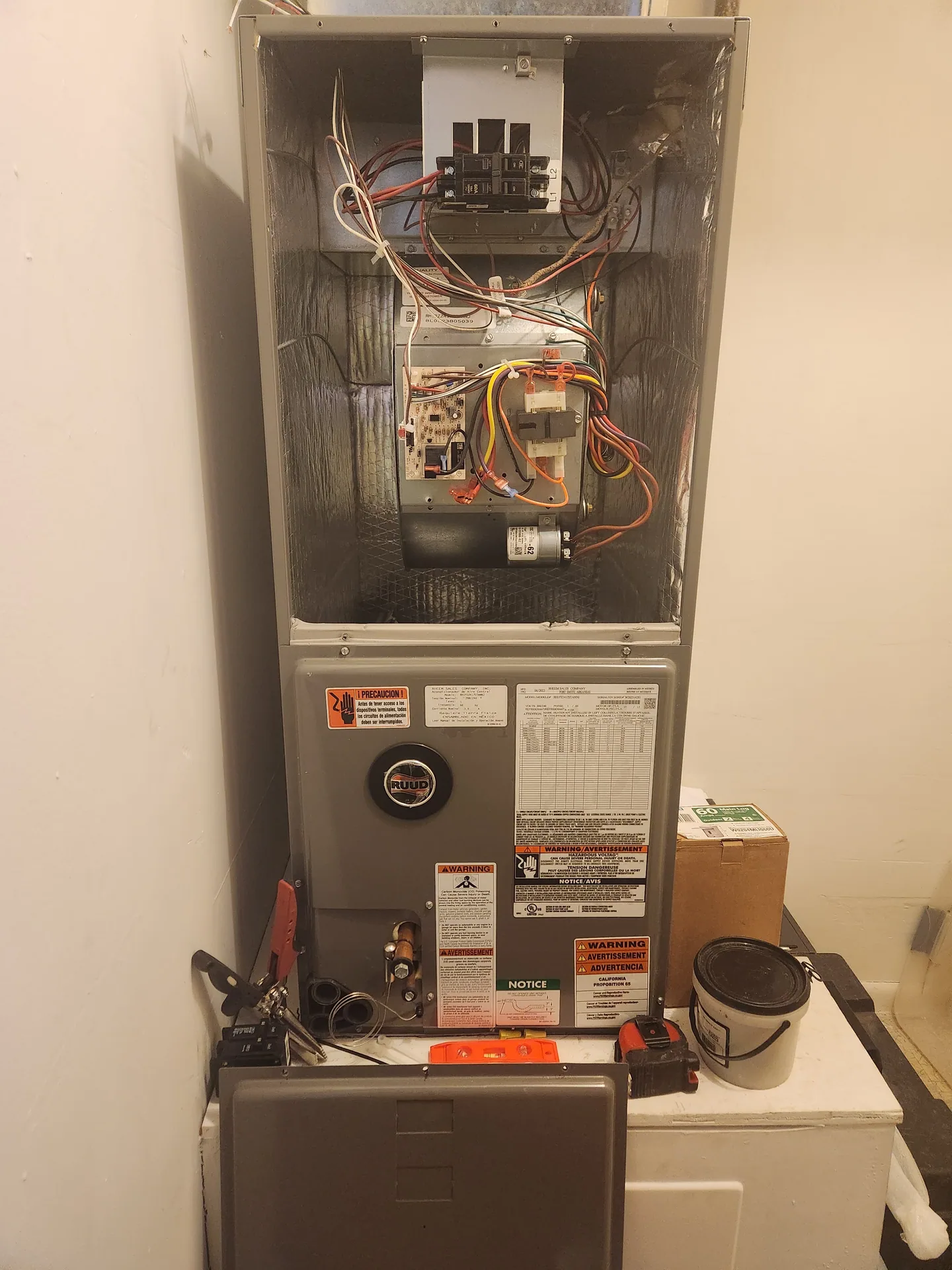 Open residential furnace cabinet and service tools